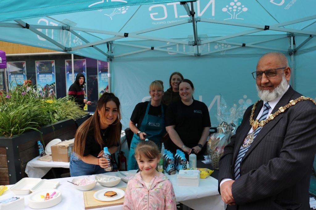 Our friendly NLTG staff hosting cake decoration at the 2022 Accrington Food & Drink Festival. 
